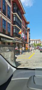 a view of a city street from a car window at Gran Hotel Paraiso in Llanes