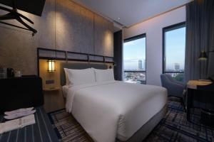 Mercure Surabaya Manyar客房内的一张或多张床位