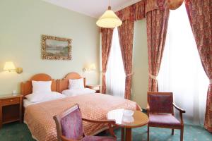 Voodi või voodid majutusasutuse Hotel Pavlov toas