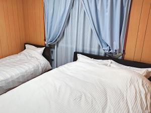 Кровать или кровати в номере 新富
