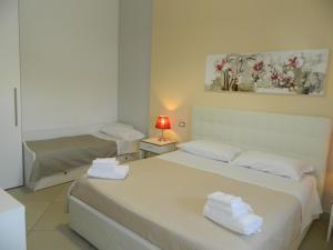 A bed or beds in a room at A Casa di Anna - Locazione Turistica -