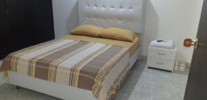 Postel nebo postele na pokoji v ubytování Casa Familiar Miguel Angel