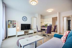 a living room with a couch and a table at Villa Grdelina in Supetar