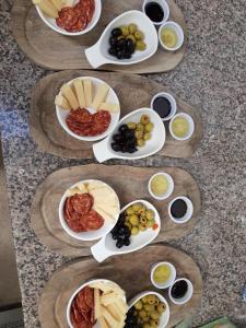 a group of plates of food with grapes and olives at The Narrows in Portaferry