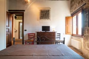 TV a/nebo společenská místnost v ubytování La Suite del Borgo