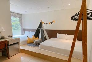 Voodi või voodid majutusasutuse Wulai Karuizawa Inn toas