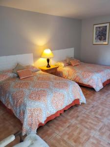 Postel nebo postele na pokoji v ubytování Conty's Motel