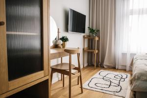 Televízia a/alebo spoločenská miestnosť v ubytovaní Apartamenty Las