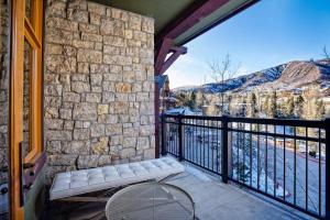 a balcony with a bench and a view of the mountains at Capitol Peak A3209 in Snowmass Village