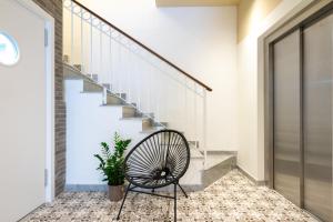 a staircase with a bench next to a stair case at Lady Todd in Sliema