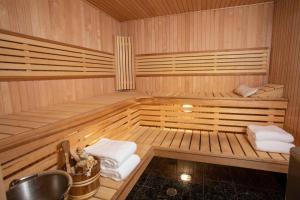 a wooden sauna with two towels in it at Top of Lemond Home in Snowmass Village
