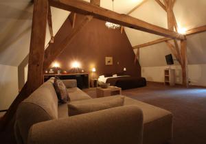 Area soggiorno di Hotel The Lodge Heverlee