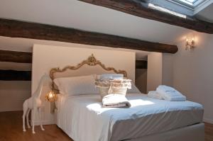 Postel nebo postele na pokoji v ubytování ca' squero911 luxury rooms