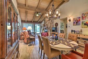 a dining room and living room with a table and chairs at Gated Home with Golf Course View and Pool Access! in Sedona