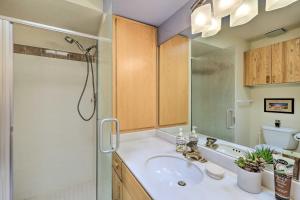 a bathroom with a sink and a shower at Sedona Home with Golf Course View and Pool Access! in Sedona +30 photos