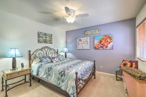 a bedroom with a bed and a ceiling fan at Gated Home with Golf Course View and Pool Access! in Sedona