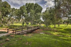 a wooden bridge over a stream in a park at Sedona Home with Golf Course View and Pool Access! in Sedona