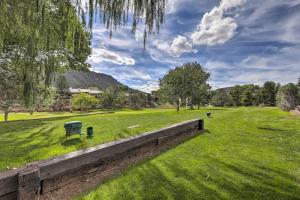 a park with a bench in a green field at Sedona Home with Golf Course View and Pool Access! in Sedona