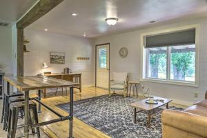 a living room with a table and a couch at Quiet Country Home in Ava with Chic Interior! in Ava +19 photos