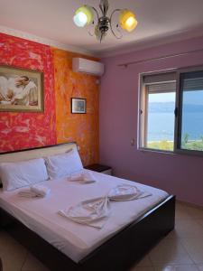 מיטה או מיטות בחדר ב-Rias Seaside Apartments