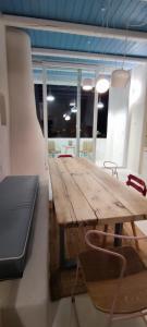 a wooden table and chairs in a room at Casa Mediterranea Jacuzzi riscaldata con Caminetto in Specchiolla