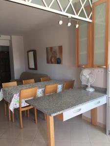 a room with two chairs and a table at Castelos da Rocha in Portimão