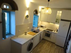 A kitchen or kitchenette at Zozef Family House