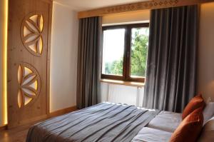 Postel nebo postele na pokoji v ubytování TATRY NA WYPASIE