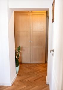 a hallway with a door and a potted plant at Lovely Day in Gdynia