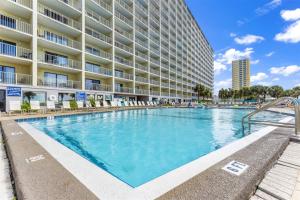 a large swimming pool in front of a building at The Summit 624 in Panama City Beach