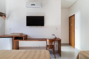 A television and/or entertainment centre at NOAH HOTEL