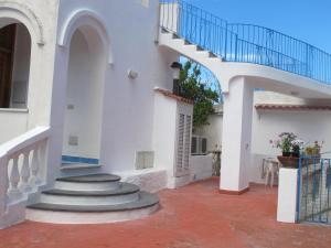 a stairway leading to a white building with a staircase at Aparthotel Villa Marinù in Ischia
