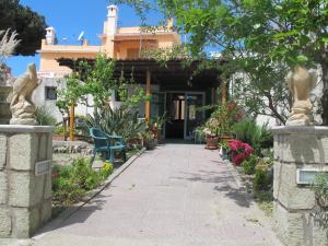 a walkway leading to the front of a house at Aparthotel Villa Marinù in Ischia