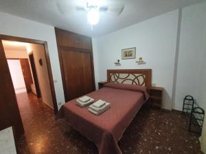 Posteľ alebo postele v izbe v ubytovaní Apartamento Acogedor en Los Patios De San Basilio