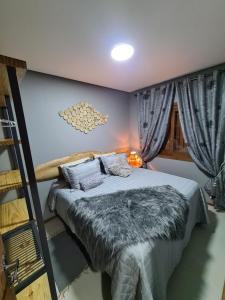 Cama ou camas em um quarto em Refúgio dos Coiotes