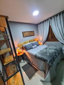 Cama ou camas em um quarto em Refúgio dos Coiotes