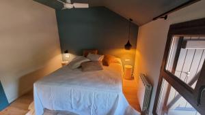 A bed or beds in a room at Tierra Boutique, Tierra Suites y Tierra Valles Apartamentos