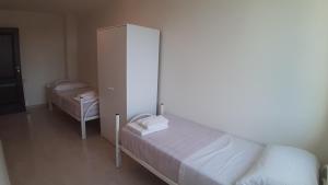 Posteľ alebo postele v izbe v ubytovaní ArmacHouse - Appartamenti sul mare