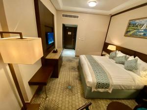 Voodi või voodid majutusasutuse Afraa Hotel Al Aziziya toas