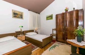 Posteľ alebo postele v izbe v ubytovaní Seaview Escape Stanići II