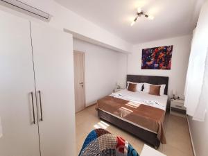 A bed or beds in a room at Bella House Nikiti