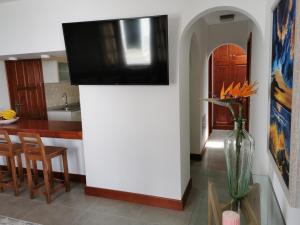 a kitchen with a tv on top of a wall at Luxury Villas Anjomacar in Teguise