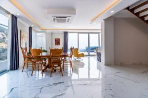 a dining room with a table and chairs at LA VILLA CELINE- Luxury Sea View Villa with Private Infinity Pool in Islamlar-Kalkan in Kalkan