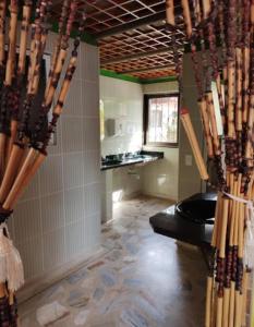 a room with a bathroom with a tub and a floor at HOTEL EL POTRILLO in El Peñol