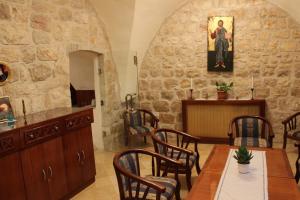 a dining room with a table and chairs at Mary's House in Bethlehem