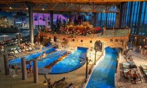 a large water slide in a large building at Appartement au cœur du Val d'Argent in Sainte-Croix-aux-Mines +18 photos