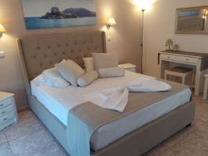 Letto o letti in una camera di Villa Soula Kaliva