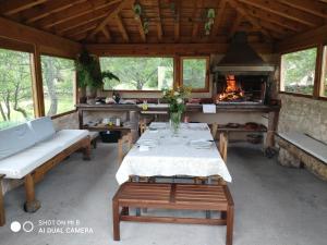 a dining room with a table and a fireplace at LA SOLANILLA -Casas Rurales in Torre Val de San Pedro