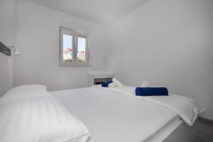Posteľ alebo postele v izbe v ubytovaní Apartments BlueView