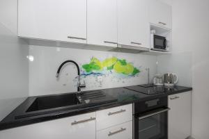 Kuchyňa alebo kuchynka v ubytovaní Apartments BlueView